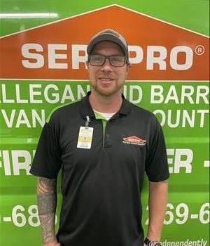 Mike standing next to SERVPRO van