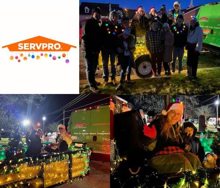 SERVPRO employees and family standing in front of decorated float