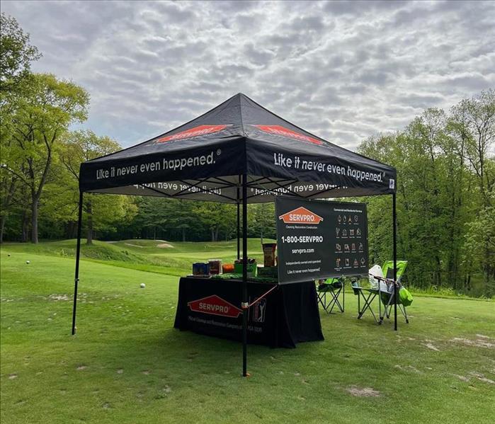 SERVPRO Tent with display table setup on golf course