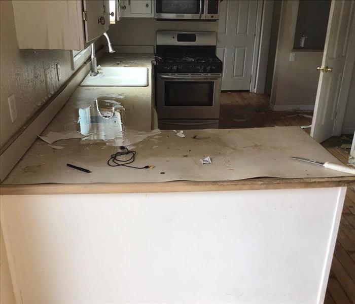 Warped countertop from water damage