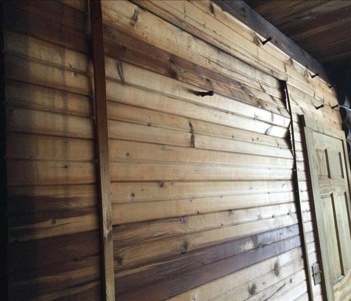 Warped Wood Walls in log cabin due to multiple frozen pipe breaks